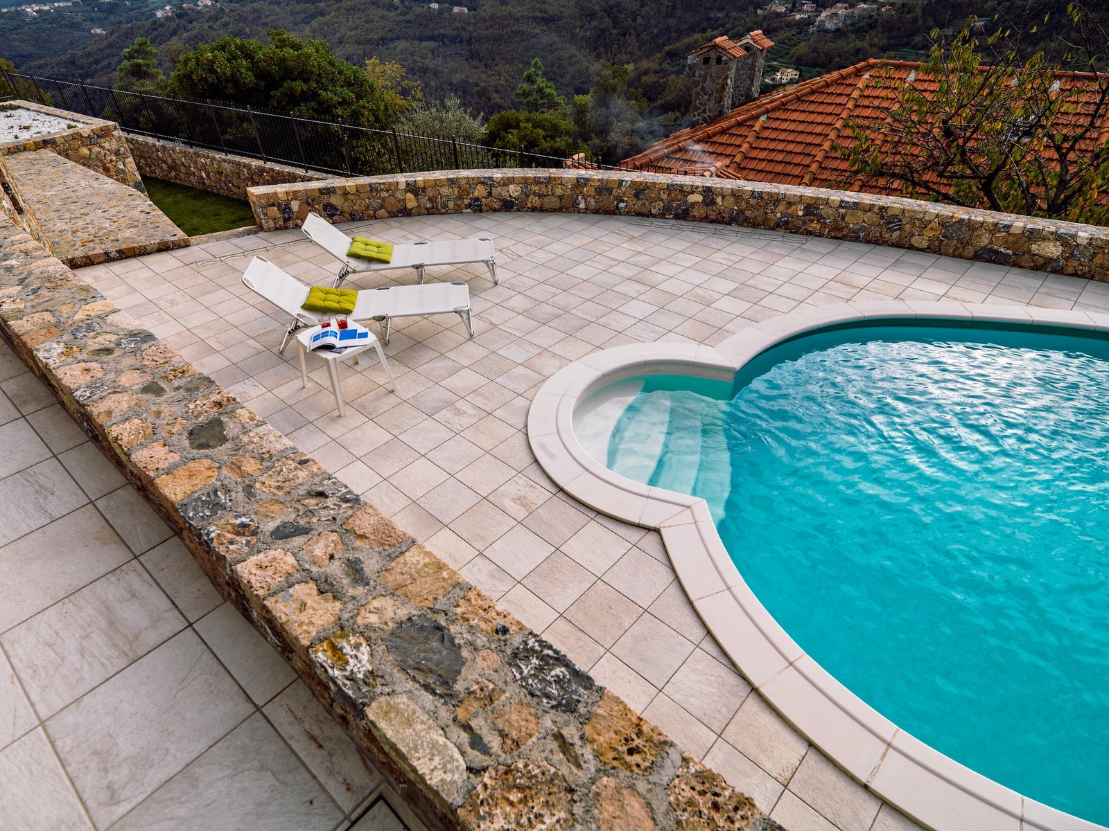 top view modern swimming pool with deck chairs